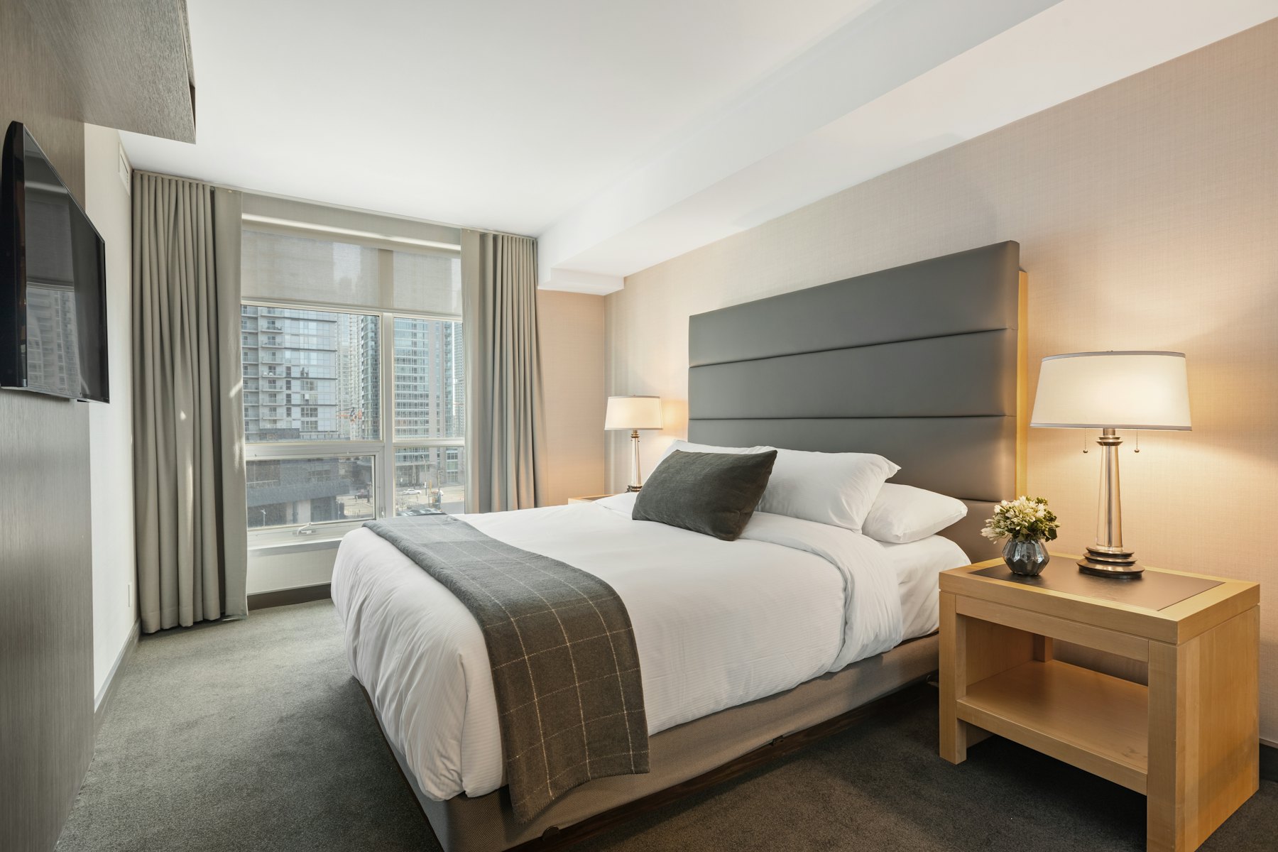 Crisp white hotel bed linen in daylight
