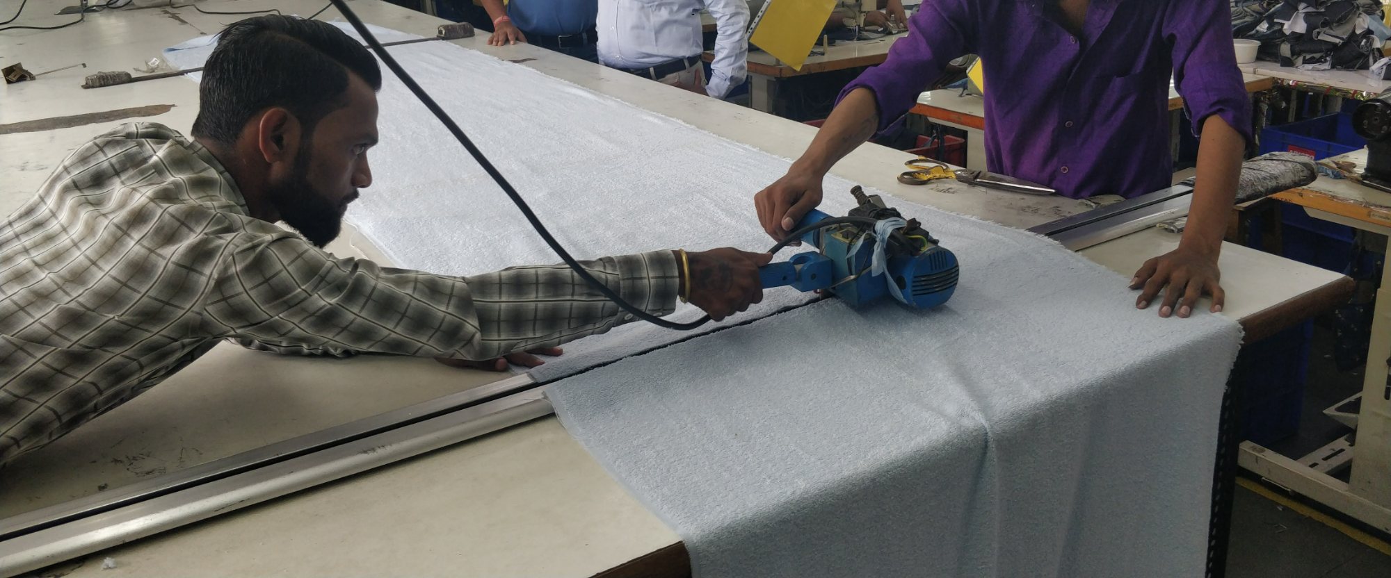 Cutting fabric to size on the cutting table